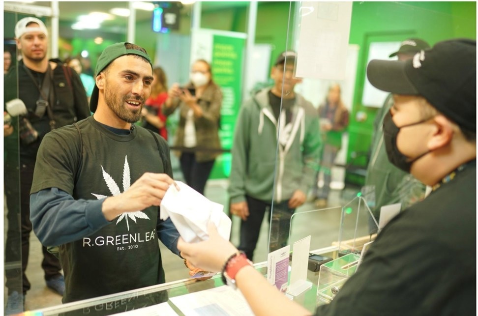 Jeremy Sandoval of Las Cruces makes the first legal purchase of recreational cannabis at R. Greenleaf in New Mexico