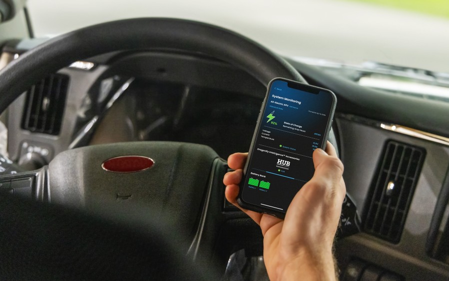 Driver monitors his truck's power system using the Battle Born mobile app.