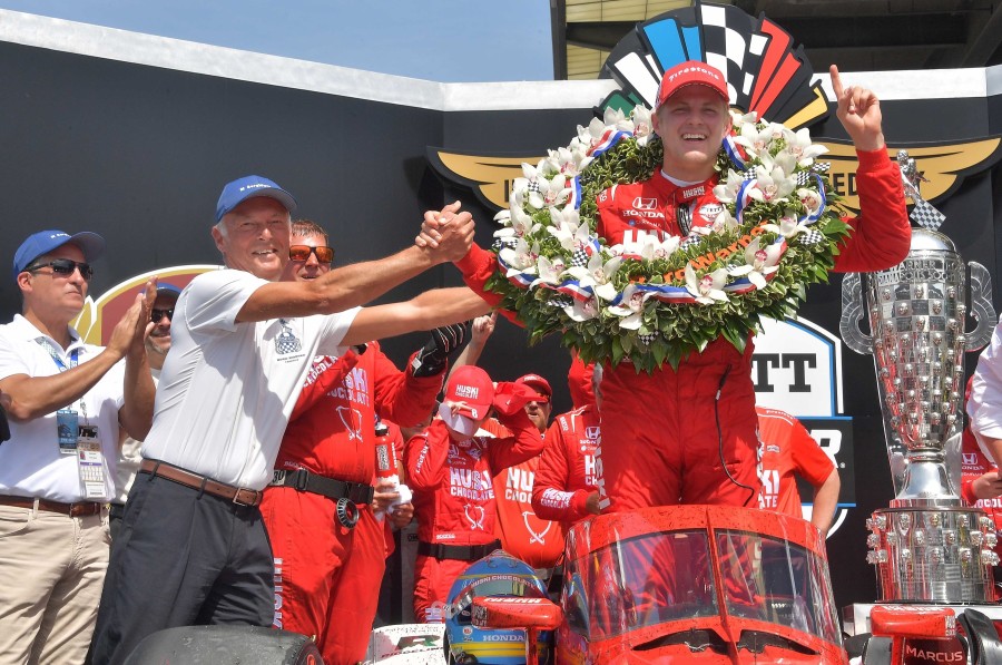 BorgWarner President and CEO, Frédéric Lissalde, congratulates the 2022 Indianapolis 500 winner, Marcus Ericsson, in Victory Circle at the Indianapolis Motor Speedway